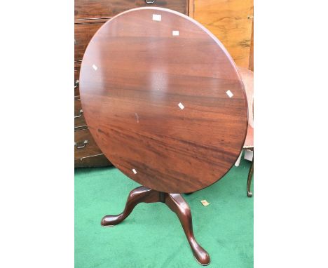 A reproduction mahogany tripod table, tilt top