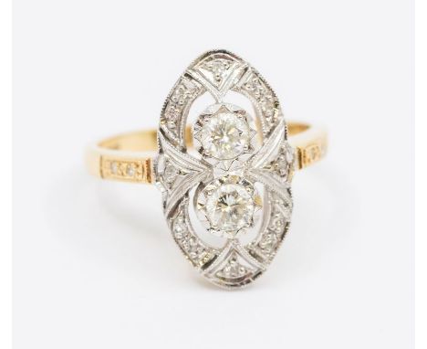 A diamond and 18ct gold dress ring, comrpsing an oval setting, illusion set with two diamonds, combined diamond weight approx