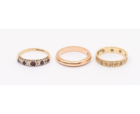 Three gold rings to include a a 9ct gold ruby and diamond half eternity ring size L,  along with a diamond cut diamond set 9c