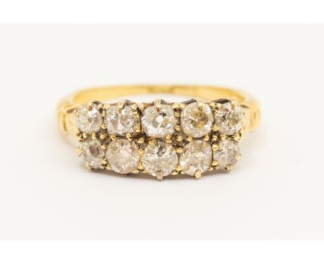 A Victorian diamond and 18ct gold double stone set ring, comprising two rows of old cut diamonds, total diamond weight approx