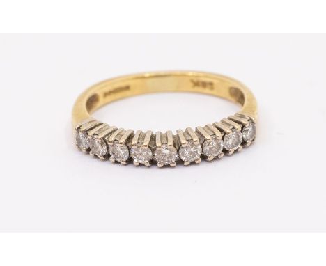 A diamond and 18ct gold half eternity ring, comprising nine round brilliant cut diamonds claw set, total diamond weight appro