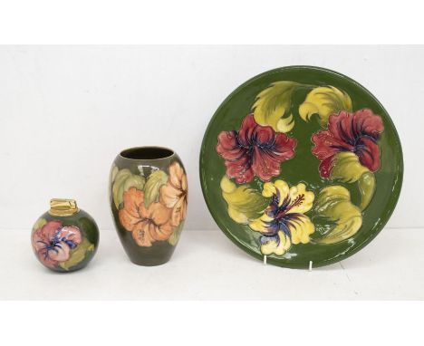 Moorcroft; Hibiscus large charger, lighter and a vase all on green ground