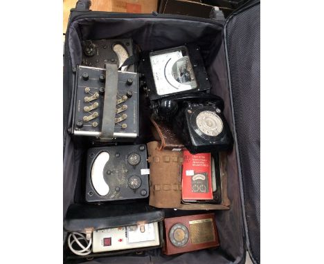 Collection of scientific instruments including wattage and amp meters, vintage telephonic avo meters