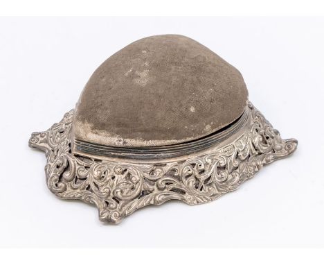 A Victorian large silver mounted heart shaped combination ring box and pin cushion, the raised silver mount chased and pieced