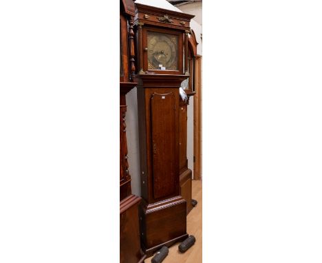 Thomas Reynolds Warwick eight day Longcase clock striking on a bell. With 11" square dial date calendar Contained in a Oak an
