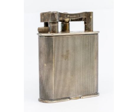 An early 20th Century large Dunhill silver plated table lighter, engine turned body, stamped DUNHILL, registration design no: