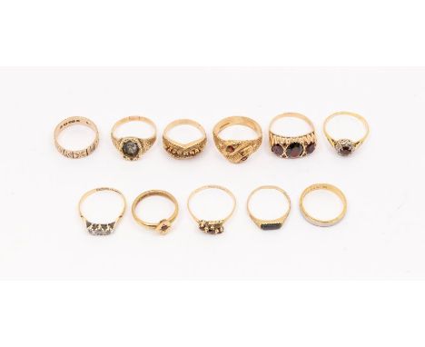 A collection of 9ct gold rings to include a three stone garnet ring, size Q, garnet set serpent ring, size Q1/2, ruby set rin