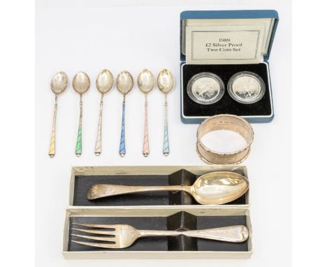 A collection of silver to include: a Harlequin set of six Elizabeth II silver and enamel coffee spoons, by CB &amp;S, Birming