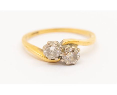 An 18ct gold and diamond 'toi-et-moi' ring, total diamond weight approx 0.40ct, size K1/2, total gross weight approx 2.6gmsFu