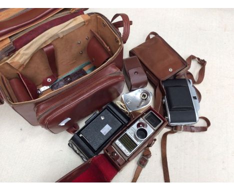 A collection of vintage cameras including GB Bell &amp; Howell, 8mm, Kodak and others