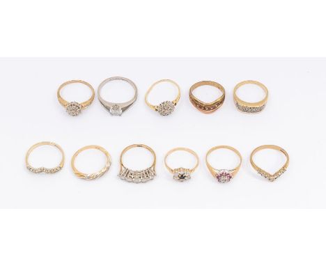 A collection of gem set 9ct gold rings to include a diamond set wish bone ring, size P, two diamond set cluster rings 9one a/