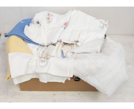 A large box of embroidered tablecloths from the 1930s, 40s, and 50s. Colourful designs and in various sizes. Also includes a 