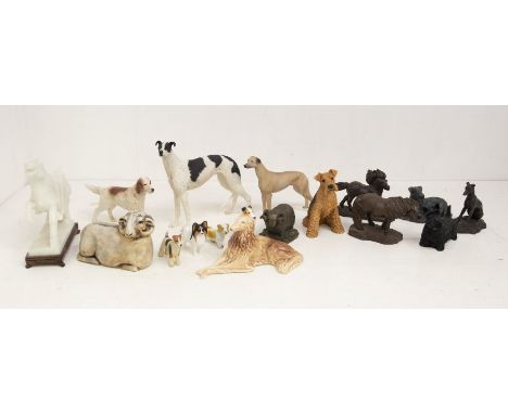 a collection of mostly dog and animal figures, ceramic resin and others