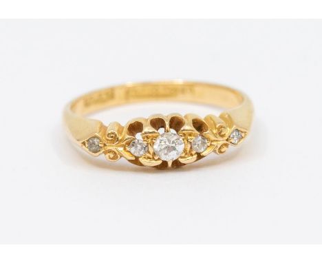 A Victorian style diamond and 18ct gold ring, comprising graduated diamonds to the top, size Q, total gross weight approx  4g