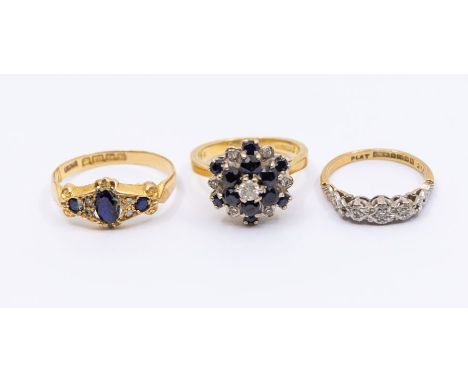 An 18ct gold sapphire and diamond cluster ring, size K, gross weight approx 6.2gms; an 18ct gold and platinum ring, set with 