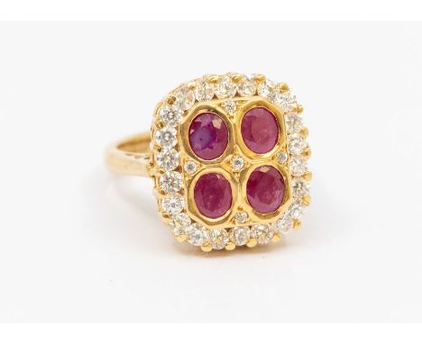 An 18ct gold ruby and white stone square cluster ring, the four oval-cut rubies surrounded by round cut stones probably CZ, h