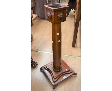 A 19th Century Arts &amp; Crafts church mahogany candle stand, with ceramic feet to square base