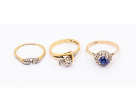 A collection of gold rings to include a diamond and 18ct gold cross over ring, set with a single round brilliant cut diamond 