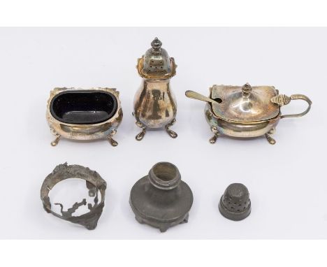 A Georgian style three piece condiment set including salt, pepper pot and mustard pot, one blue glass liner, hallmarked by Wa