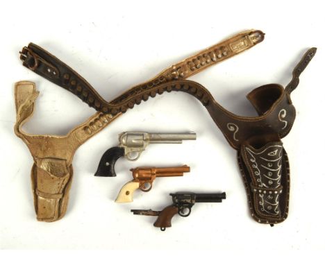 Gerry Anderson: Joe 90, episode Lone-Handed 90 (1969)   Three miniature revolver handguns contained in leather holsters, as m