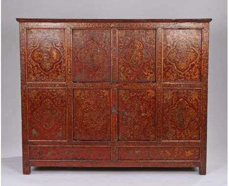 Late 19th Century Tibetan painted pine food chest, the rectangular top above the floral panel cupboard base raised on block s