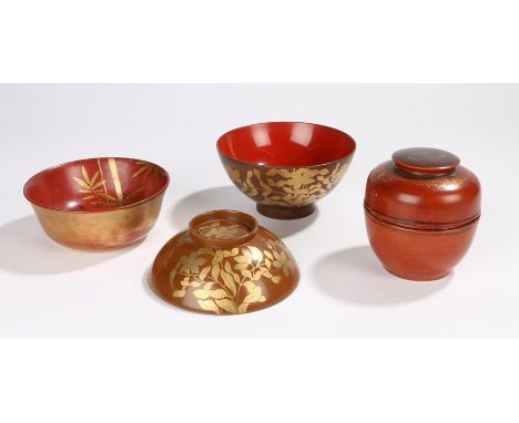 Meiji period lacquer bowls, a bowl and lid of pale brown lacquer decorated with gilt foliage, a red lacquer bowl with gilt ba