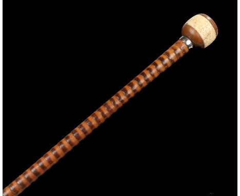 Early 20th Century walking stick, the orb form finial with ivory central section carved with crescent moons, on a hardwood ri