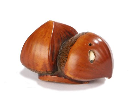 Japanese Edo period netsuke, the wooden Netsuke depicting three chestnuts, one chestnut has a maggot emerging, 4.5 cm across