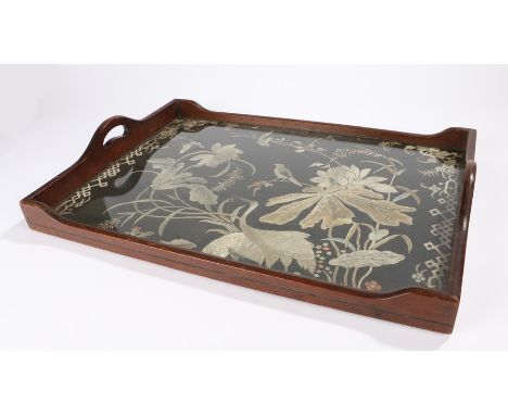 19th century mahogany and ebony strung tray, the border with pierced carrying handles, the central field inset with a silk pa