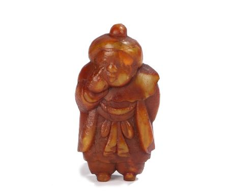 Japanese Meiji period netsuke, depicting Daruma pulling his lower eyelid down and hiding a mask of Okame behind his back. 5cm