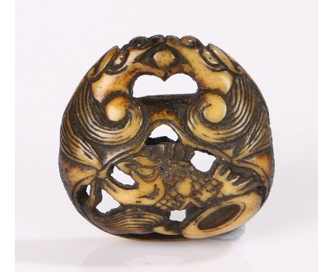 Japanese Edo period netsuke, the stag antler netsuke carved as two dragons confronting each other with a sacred jewel in thei