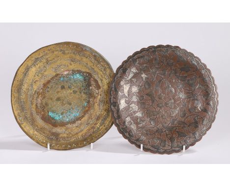Two 19th Century dishes, the first a Middle East example with stylised leaf decoration, 20cm wide, the second an Indian brass