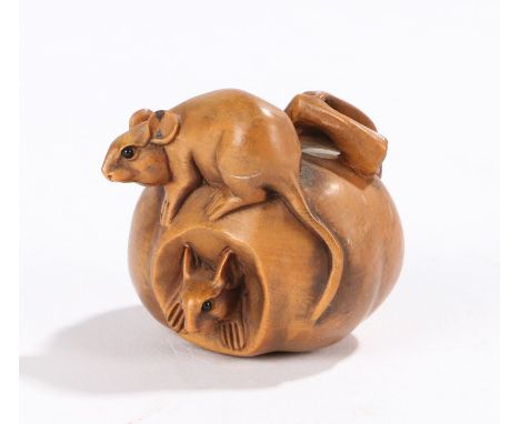 Japanese wood carved netsuke, carved with two mice in and on a piece of fruit, signed to the base, 37mm diameter 