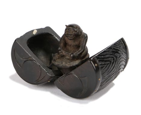Japanese Edo period netsuke, the netsuke depicting Raijin concealed within his thunder drum revealed when the drum is opened,