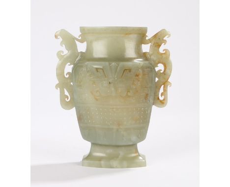 Chinese jade vase, with pierced scrolled handles flanking the scroll and bead decorated body, raised on a tapering foot, 15cm