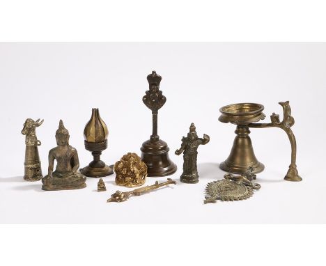 19th and 20th Century Indian devotional objects to include a metal folding petal lamp, Buddha, Ganesha, Vishnu, a bell etc. (