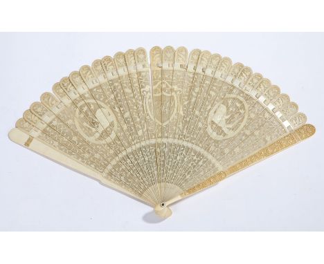 Early 19th Century Canton ivory lace-work fan,the sticks finely carved overall with twining leaves and flowers,  two panels d