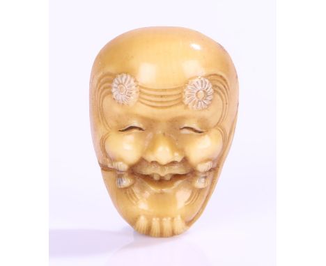 Japanese ivory noh mask netsuke, the mask with flower heads to the forehead, 3.5cm high