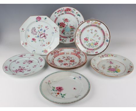 A group of eight Chinese famille rose porcelain plates, 18th century, painted with various floral designs, one of octagonal f