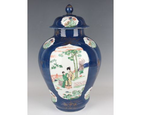 A Continental Chinese export style porcelain vase and cover, Kangxi style but late 19th century, the baluster body painted in