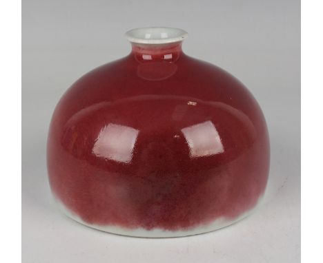 A Chinese sang-de-boeuf glazed porcelain beehive water coupe, mark of Kangxi but later Qing dynasty, of hemispherical form, u