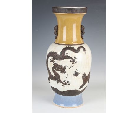 A Chinese crackle glazed vase, late Qing dynasty, the ogee baluster body decorated in relief with iron oxide washed dragon, f