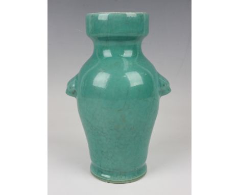 A Chinese green crackle glazed porcelain vase, late Qing dynasty, of baluster form with moulded lion mask handles and cylindr