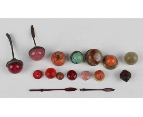 A small collection of Chinese snuff bottle stoppers, Qing dynasty, including rose quartz, coral and other hardstone examples.