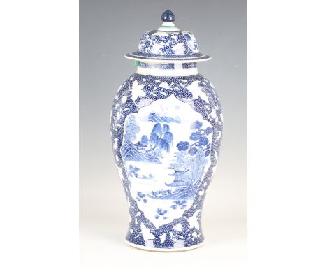 A Chinese blue and white export porcelain vase and cover, Qianlong period, of baluster form, painted with opposing coastal la