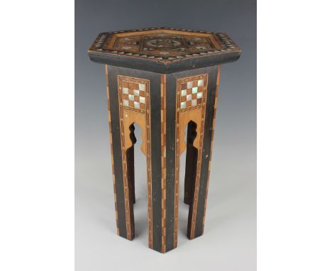 A Syrian inlaid hexagonal table, early 20th century, probably retailed by Liberty &amp; Co, the top and sides with mixed wood