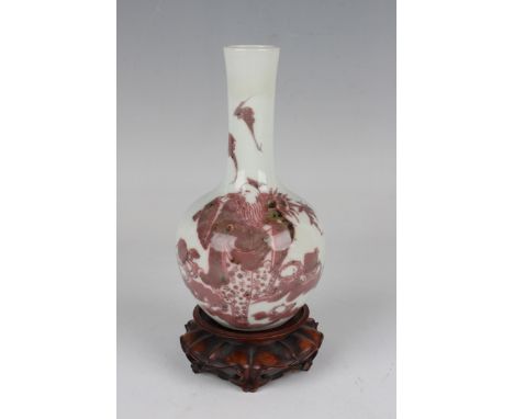 A Chinese underglaze red and white porcelain bottle vase, mark of Kangxi but later Qing dynasty, the globular body and narrow