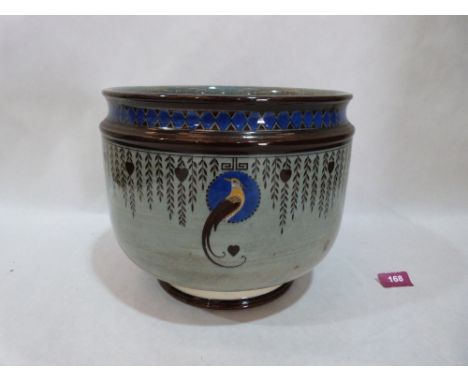 A Royal Doulton 'Titanian' jardiniere, decorated with exotic birds and hanging hearts and foliage on a lustrous titanium glaz