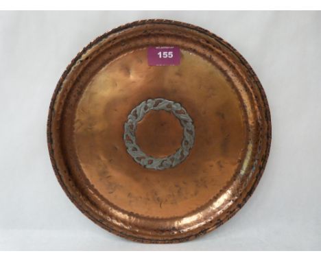 A Hugh Wallace planished copper and silvered dish, the centre with a ring of fruiting foliage. Impressed monogram c.1910. 10'