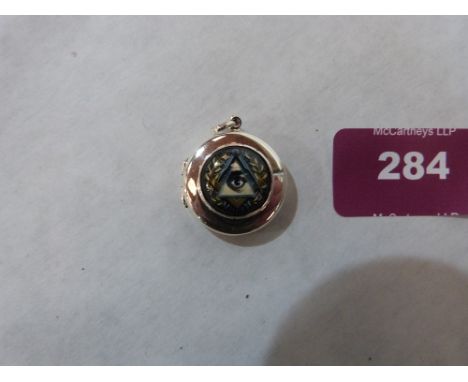 A silver fob pill box with masonic enamel decoration. 1' diam